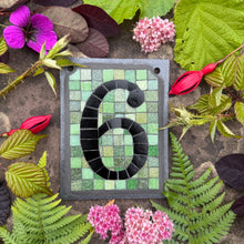 Flat black number with an olive background