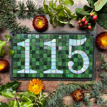 White iridescent number with a dark green background