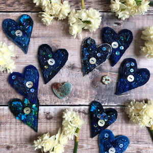 Fabric heart brooches in blues