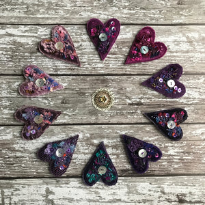 Fabric heart brooches in purples