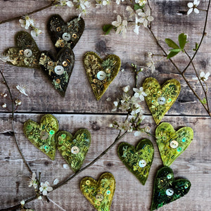 Fabric heart brooches in greens