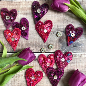Fabric heart brooches in pinks