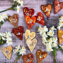 Fabric heart brooches in oranges and yellows