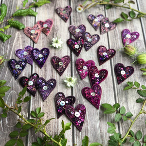 Fabric heart brooches in purples
