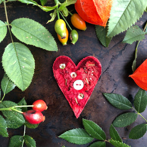 Fabric heart brooches in reds